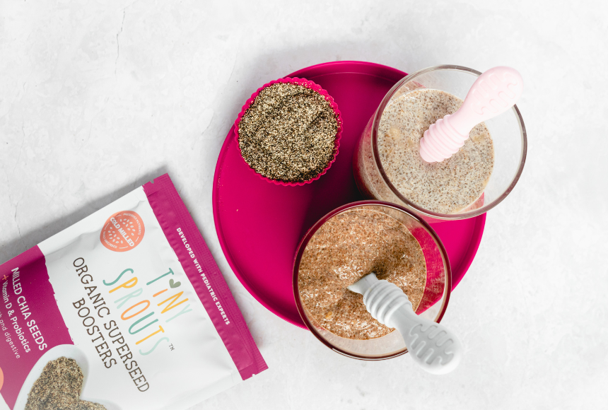 banana chocolate chia pudding on pink plate with milled chia seeds on white counter